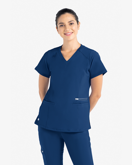 The Active Fashion Top provides comfort and support for those long hours on your feet.

Features:
V-Neckline
Two spacious pockets and a third zip pocket
VioFence antimicrobial proprietary technology

Fabric: Polyester /Rayon/ Spandex